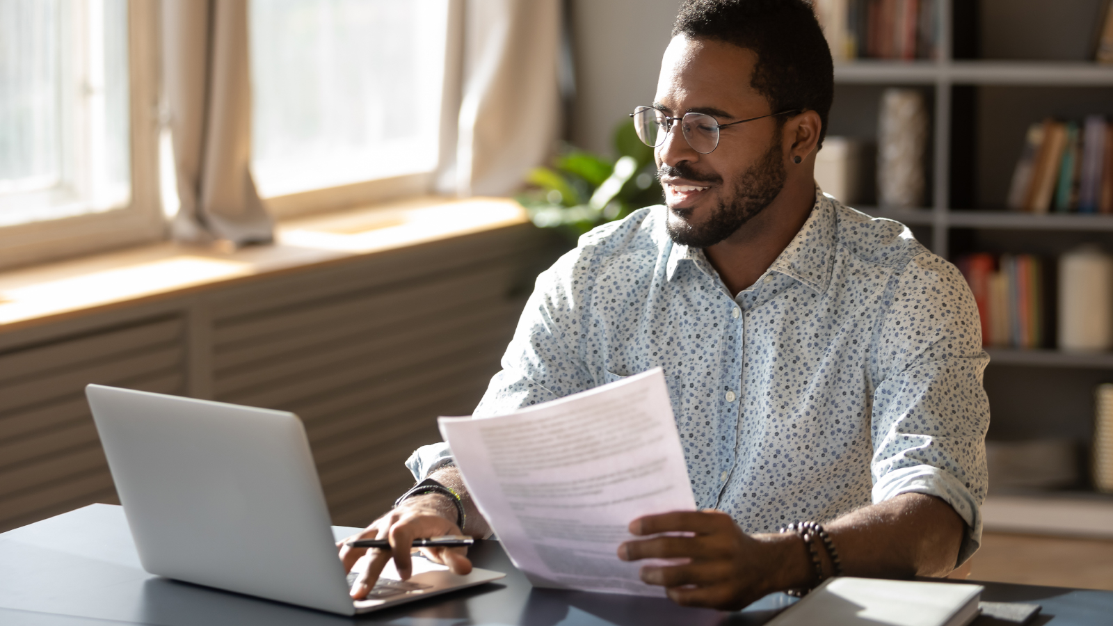 man checking online eStatements on computer