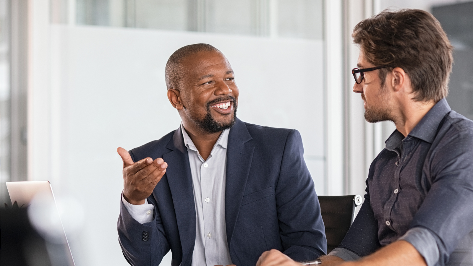 two business men discussing an account