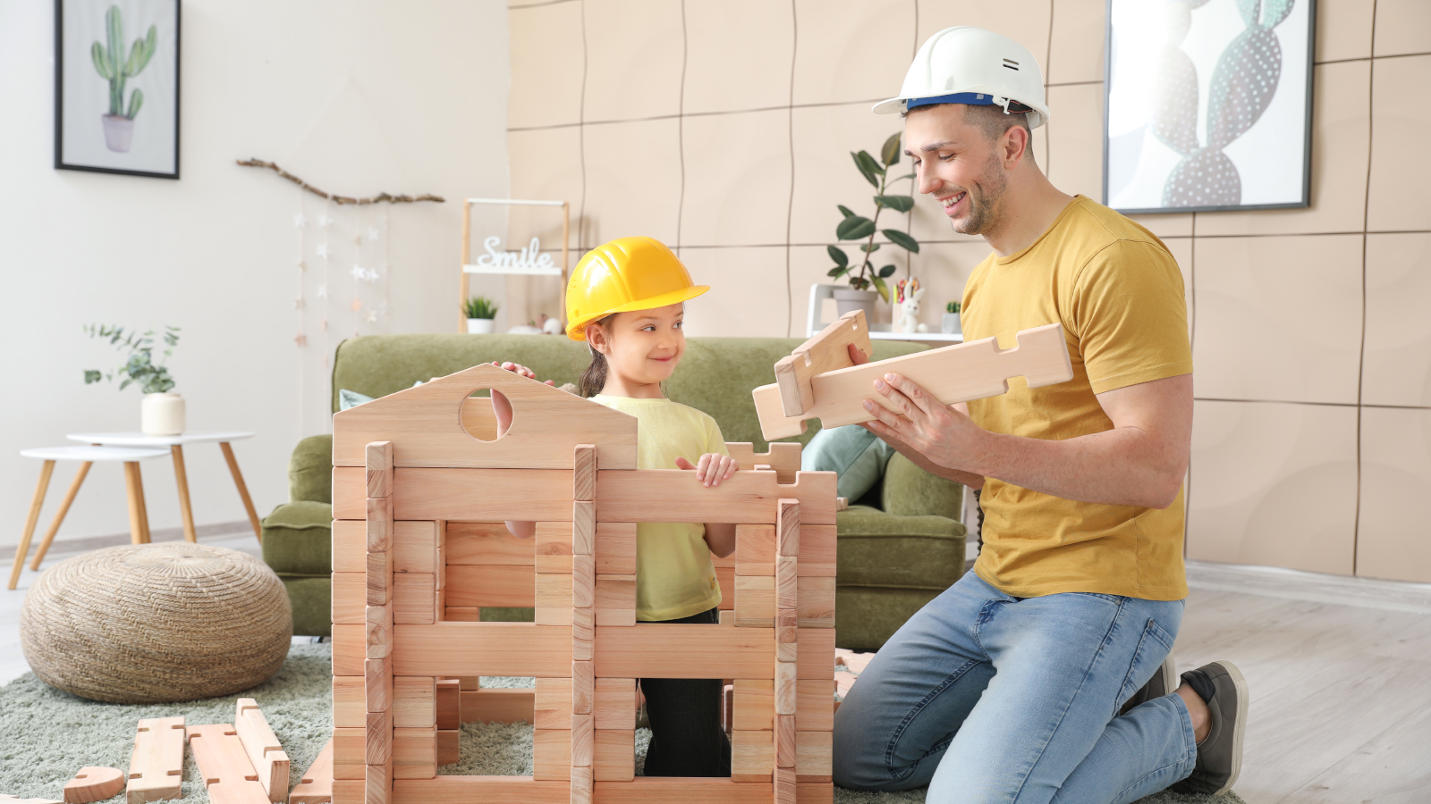 father daughter building in living room
